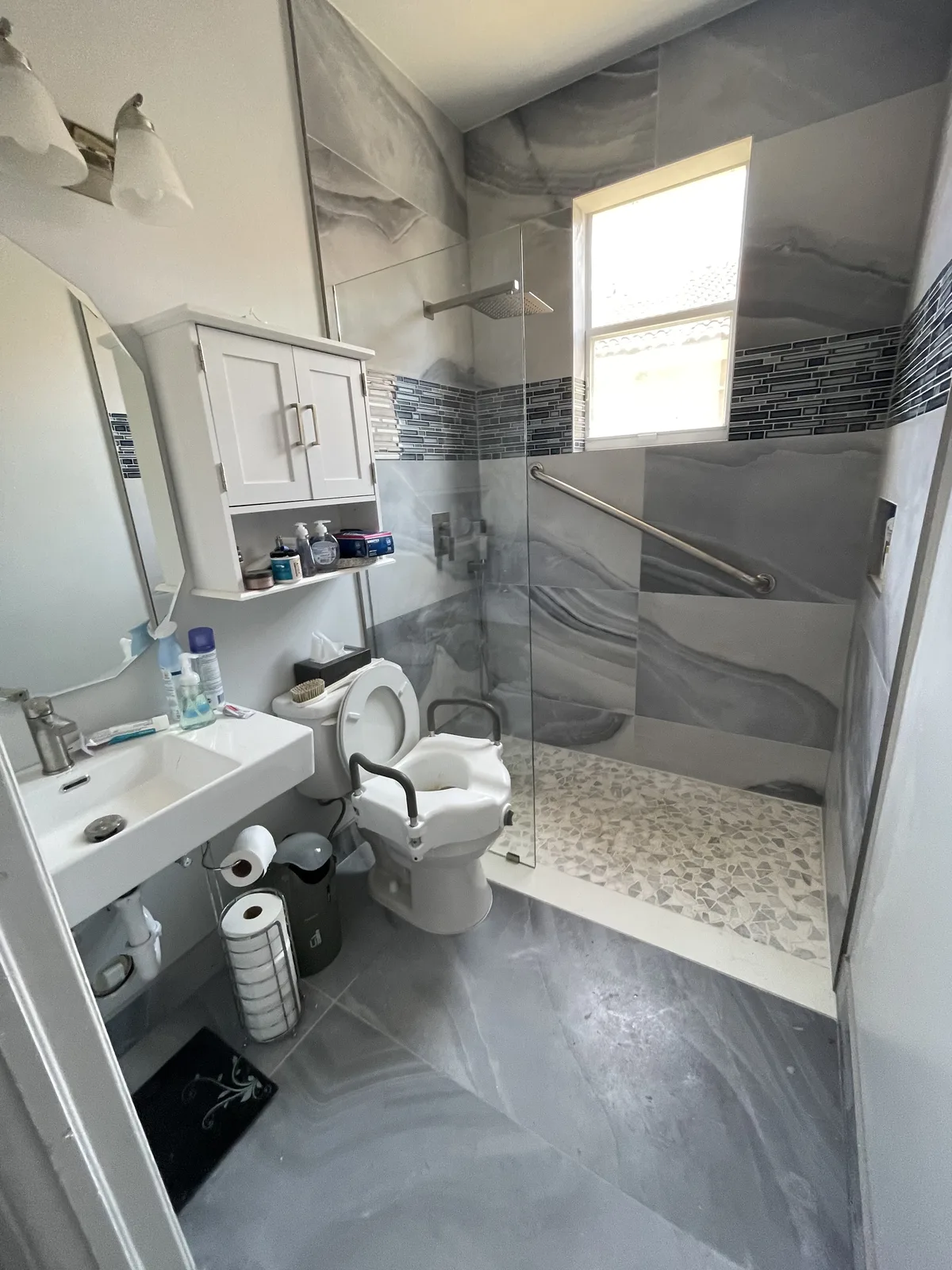 Tub-to-shower conversion with gray plank tile in Fort Lauderdale, FL