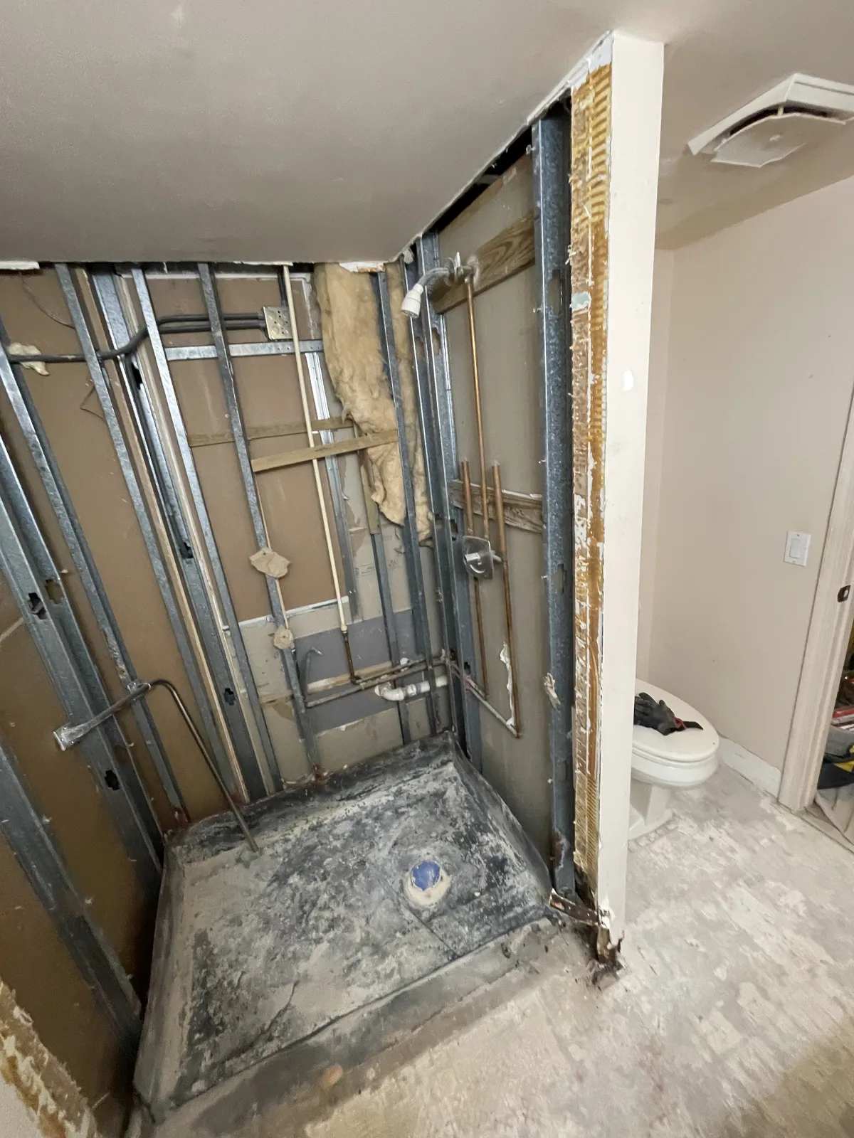 Before — Coastal guest bathroom remodel with marble tile and soaking tub in Fort Lauderdale, Broward County